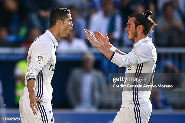 Cristiano Ronaldo of Real Madrid CF celebrates scoring their opening goal with team mate Gareth Bale during the La Liga match between Deportivo...