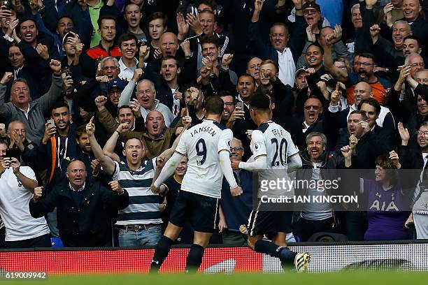 Tottenham Hotspur's Dutch striker Vincent Janssen celebrates with Tottenham Hotspur's English midfielder Dele Alli after scoring the opening goal...
