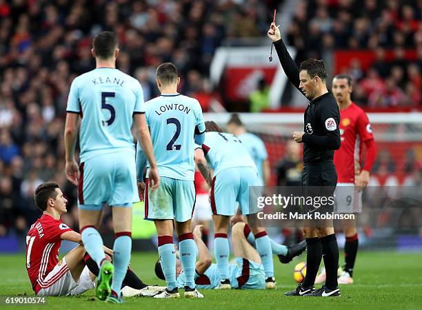 Ander Herrera of Manchester United is shown the red card by referee Mark Clattenburg after the second yellow card during the Premier League match...