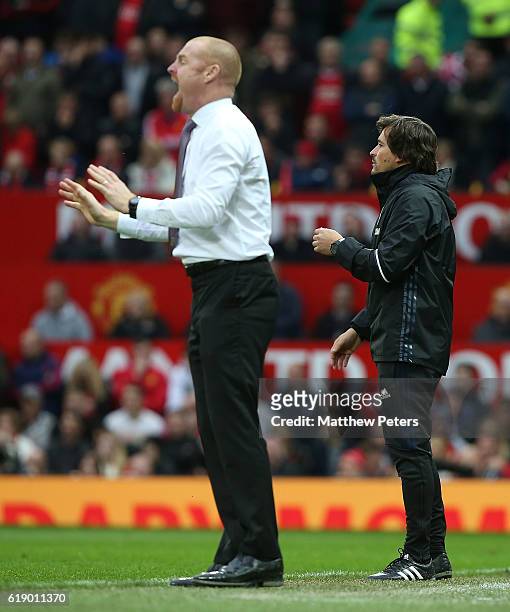 Assistant Manager Rui Faria of Manchester United and Manager Sean Dyche of Burnley watch from the touchline during the Premier League match between...