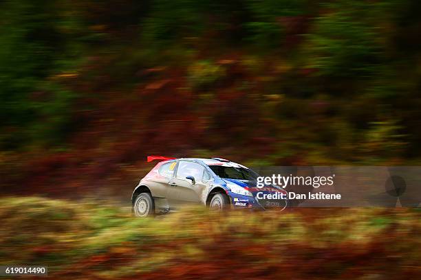 Jose Antonio Suarez Miranda of Spain and Peugeot Rally Academy drives with co-driver Candido Carrera Estevez of Spain and Peugeot Rally Academy...