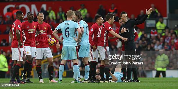 Ander Herrera of Manchester United is sent off by referee Mark Clattenburg during the Premier League match between Manchester United and Burnley at...