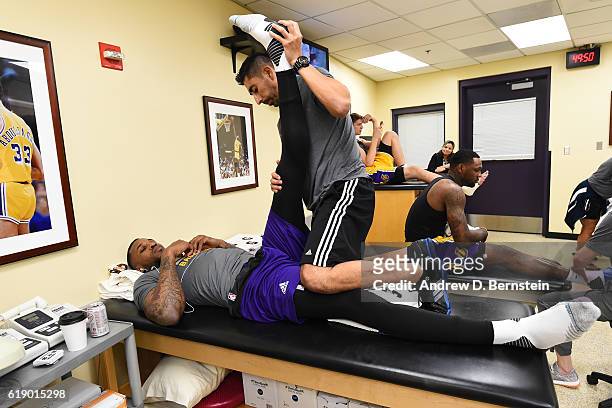 Tarik Black of the Los Angeles Lakers gets treatment from trainer, Marco Nunez before the game against the Houston Rockets on October 26, 2016 at...