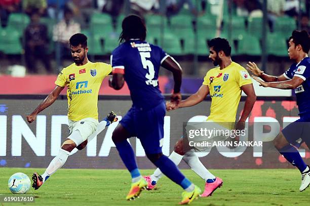 Chennaiyin FC's defender Bernard Mendy vies for the ball with Kerala Blaster FC's Forward Mohammed Rafique during the Indian Super League football...