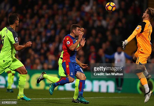 James McArthur of Crystal Palace heads the ball to score his team's first goal during the Premier League match between Crystal Palace and Liverpool...