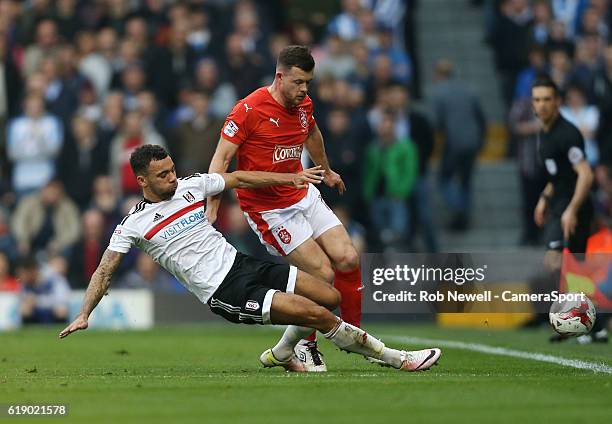 Huddersfield Town's Harry Bunn is challenged by Fulham's Ryan Fredericks during the Sky Bet Championship match between Fulham and Huddersfield Town...