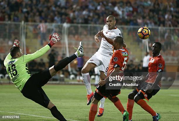 Eren Derdiyok of Galatasaray in action against Goran Karacic Mauricio Ramos and Ousmane Viera of Adanaspor during the Turkish Spor Toto Super Lig...