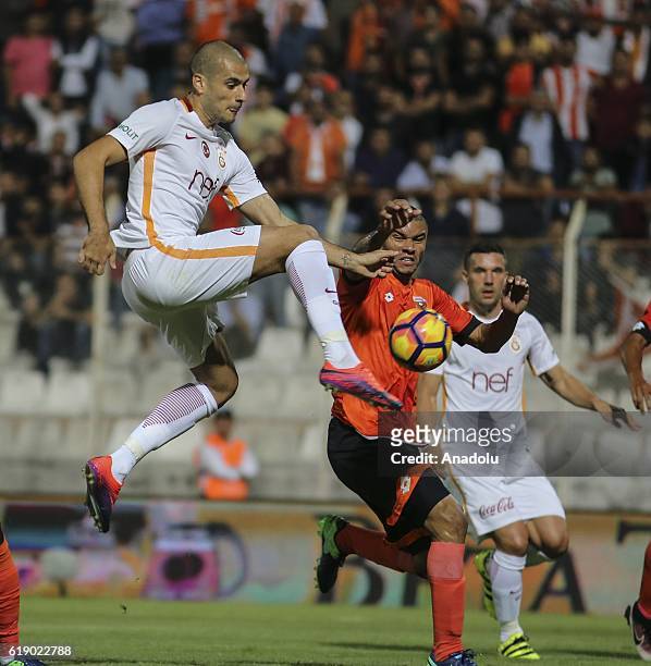 Eren Derdiyok of Galatasaray in action against Ousmane Viera of Adanaspor during the Turkish Spor Toto Super Lig football match between Adanaspor and...