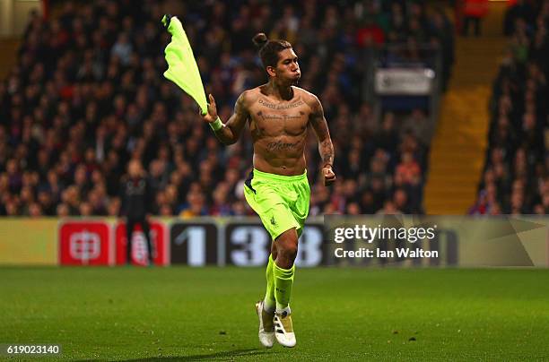 Roberto Firmino of Liverpool celebrates after scoring his team's fourth goal of the game during the Premier League match between Crystal Palace and...