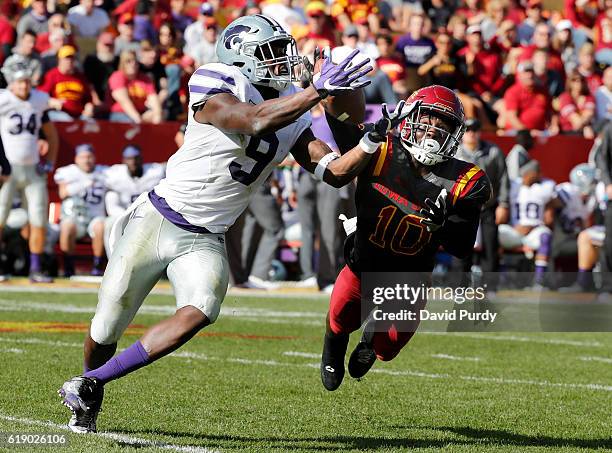 Defensive back Brian Peavy of the Iowa State Cyclones breaks up a pass meant for wide receiver Byron Pringle of the Kansas State Wildcats in the...