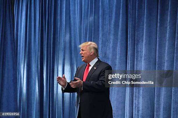 Republican presidential nominee Donald Trump arrives for a campaign rally in the Rodeo Arena at the Jefferson County Fairgrounds October 29, 2016 in...