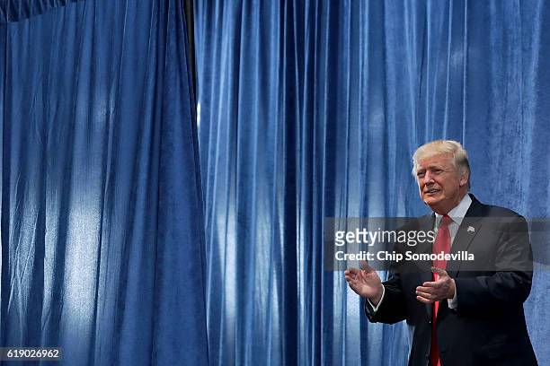 Republican presidential nominee Donald Trump arrives for a campaign rally in the Rodeo Arena at the Jefferson County Fairgrounds October 29, 2016 in...