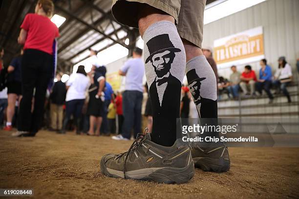 Man wears socks with the image of Abraham Lincoln during a rally for Republican presidential nominee Donald Trump in the Rodeo Arena at the Jefferson...