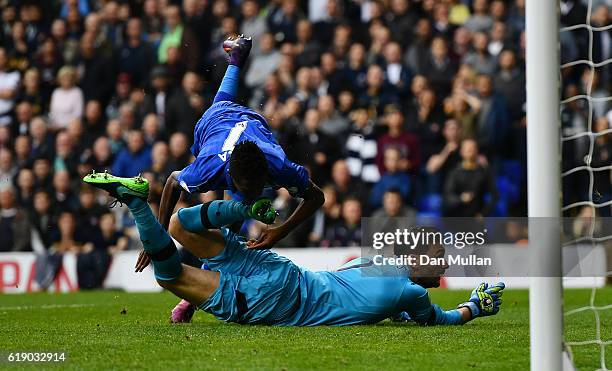 Ahmed Musa of Leicester City collides with Hugo Lloris of Tottenham Hotspur after scoring his side's first goal during the Premier League match...