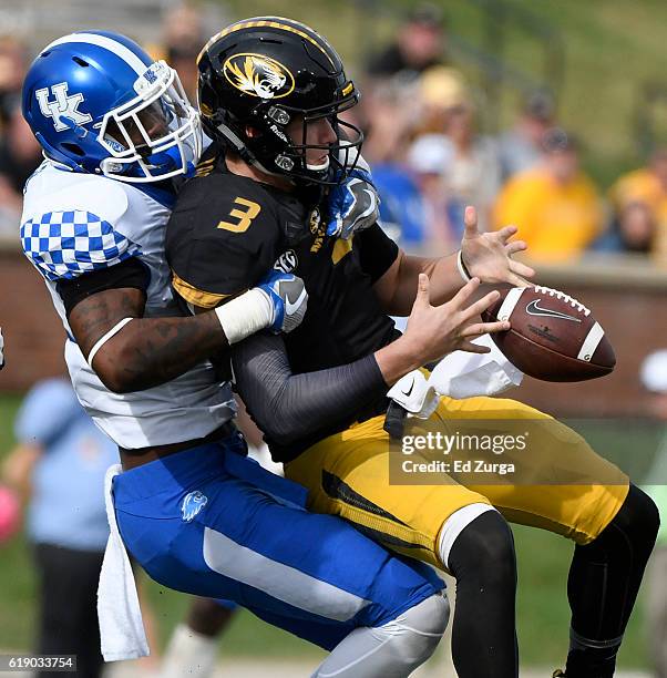 Drew Lock of the Missouri Tigers fumbles the ball as he is hit by Josh Allen of the Kentucky Wildcats in the fourth quarter at Memorial Stadium on...