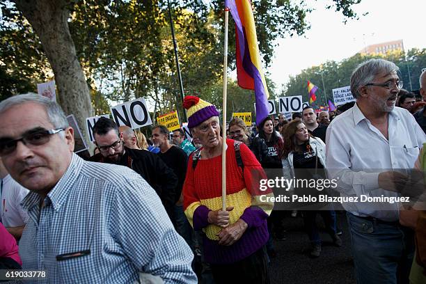 Demonstrators hold placards as the investiture debate takes place near the Spanish Parliament on October 29, 2016 in Madrid, Spain. Rajoy is due to...