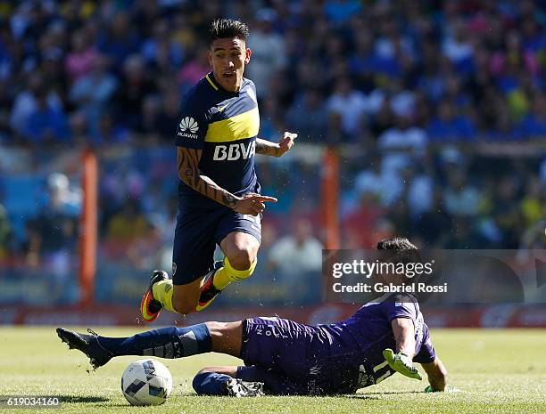 Ricardo Centrion of Boca Juniors fights for the ball with Matias Ibañez of Temperley during a match between Boca Juniors and Temperley as part of...