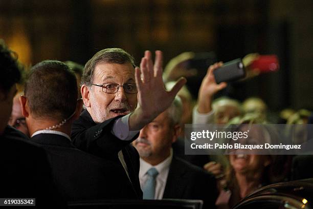 Acting Spanish Prime Minister Mariano Rajoy waves to his supporters after winning the investiture debate at the Spanish Parliament on October 29,...