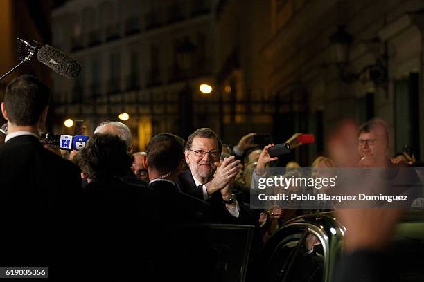 Acting Spanish Prime Minister Mariano Rajoy waves to his supporters after winning the investiture debate at the Spanish Parliament on October 29,...