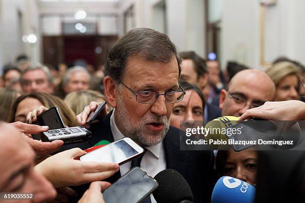 Acting Spanish Prime Minister Mariano Rajoy speaks to the press after winning the investiture debate at the Spanish Parliament on October 29, 2016 in...