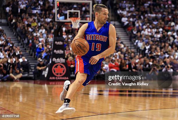 Beno Udrih of the Detroit Pistons dribbles the ball during an NBA game against the Toronto Raptors at Air Canada Centre on October 26, 2016 in...