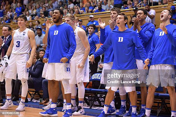Players of the Duke Blue Devils react from their bench during their game against the Virginia State Trojans at Cameron Indoor Stadium on October 28,...