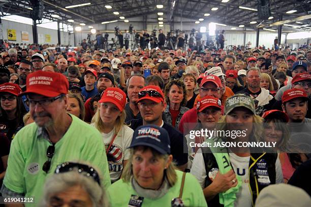 Supporters of Republican Presidential nominee Donald Trump listen as he addresses a capacity crowd at the Jefferson County Fairgrounds - Rodeo Arena...