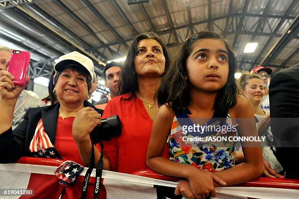 Supporters of Republican Presidential nominee Donald Trump listen as he addresses a capacity crowd at the Jefferson County Fairgrounds - Rodeo Arena...
