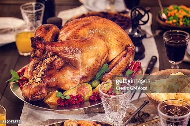 traditional stuffed turkey holiday dinner with vegetables and pumpkin pie - stuffed turkey stock pictures, royalty-free photos & images