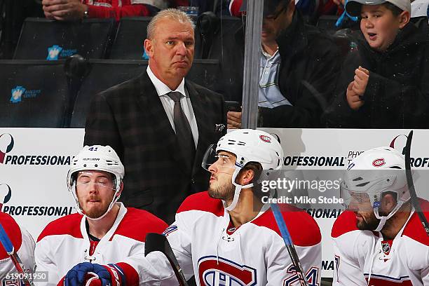 Michel Therrien of the Montreal Canadiens looks on from the bench against the New York Islanders at the Barclays Center on October 26, 2016 in...