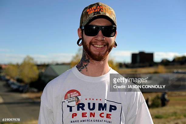 Republican presidential nominee Donald Trump supporter, Luke Fallenttine of Monument, Colorado, waits in line outside of the Jefferson County...