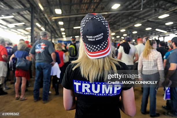 Supporters of Republican Presidential nominee Donald Trump listen as he addresses a capacity crowd at the Jefferson County Fairgrounds - Rodeo Arena...