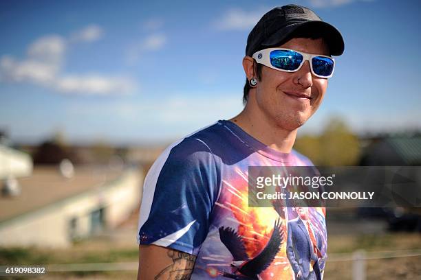 Republican presidential nominee Donald Trump supporter, William Peterson, waits in line outside of the Jefferson County Fairgrounds - Rodeo Arena &...