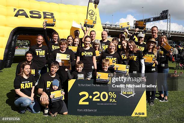 Wiiner of the ASB Run Down The Rate celebrate after the finish of the ASB Auckland Marathon on October 30, 2016 in Auckland, New Zealand.