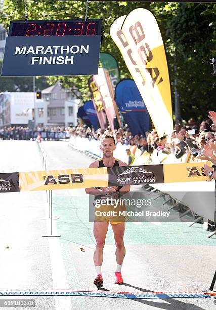 Oska Inkster-Baynes crossed the finish line to win the ASB Auckland Marathon during the ASB Auckland Marathon Run Down The Rate promotion on October...