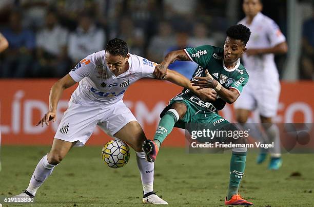 Tche Tche of Palmeiras fights for the ball with Ricardo Oliveira of Santos during the match between Santos and Palmeiras for the Brazilian Series A...