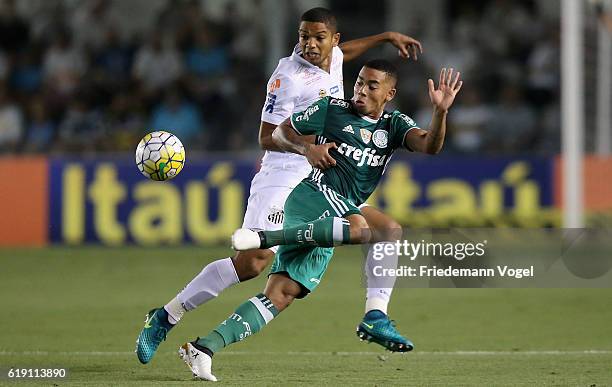 Gabriel Jesus of Palmeiras fights for the ball with David Braz of Santos during the match between Santos and Palmeiras for the Brazilian Series A...