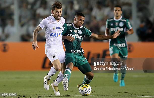 Gabriel Jesus of Palmeiras fights for the ball with Lucas Lima of Santos during the match between Santos and Palmeiras for the Brazilian Series A...