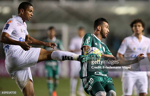 Cleiton Xavier of Palmeiras fights for the ball with David Braz of Santos during the match between Santos and Palmeiras for the Brazilian Series A...