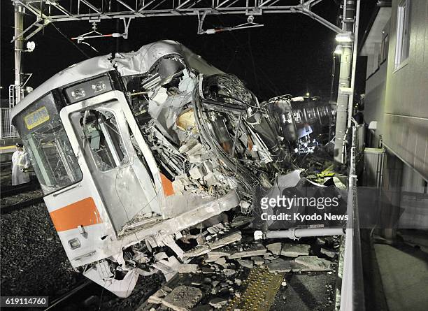 Japan - Photo shows a train operated by Sanyo Electric Railway Co. That derailed after colliding with a flatbed carrier truck at a crossing near Arai...