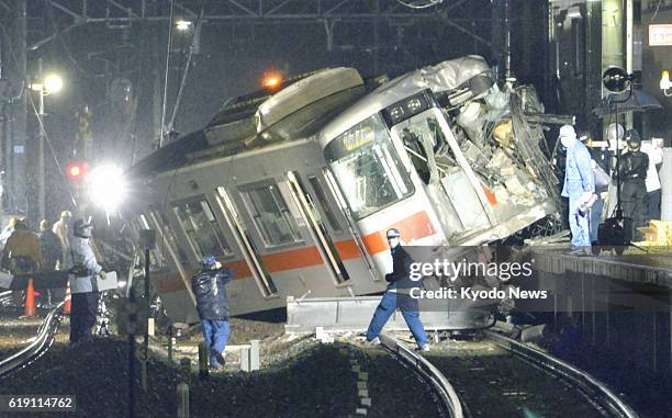 Japan - Photo shows a train operated by Sanyo Electric Railway Co. That derailed after colliding with a flatbed carrier truck at a crossing near Arai...