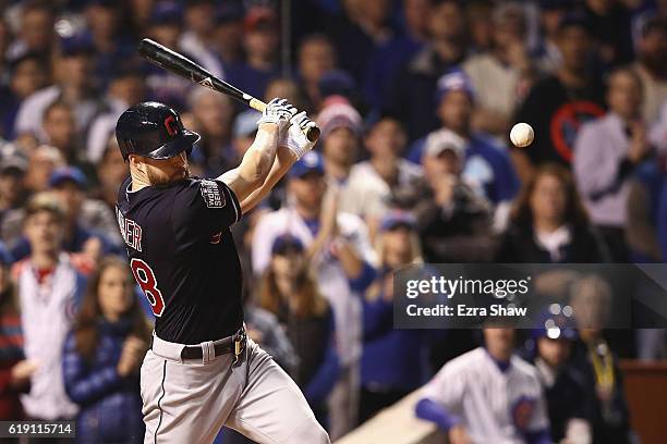 Corey Kluber of the Cleveland Indians hits a single in the second inning against the Chicago Cubs in Game Four of the 2016 World Series at Wrigley...