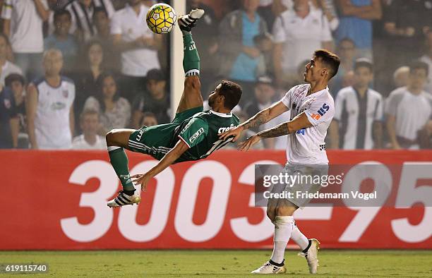 Cleiton Xavier of Palmeiras fights for the ball with Zeca of Santos during the match between Santos and Palmeiras for the Brazilian Series A 2016 at...