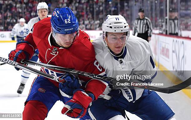 Artturi Lehkonen of the Montreal Canadiens and Zach Hyman of the Toronto Maple Leafs battle for position in the NHL game at the Bell Centre on...