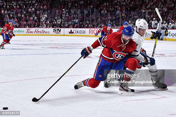 Jake Gardiner of the Toronto Maple Leafs defends against Alexander Radulov of the Montreal Canadiens during the NHL game at the Bell Centre on...