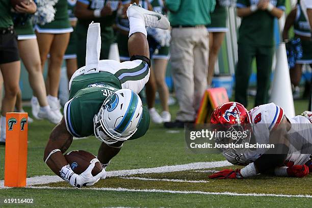 Sherman Badie of the Tulane Green Wave scores a touchdown past Rodney Clemons of the Southern Methodist Mustangs during the second half of a game at...