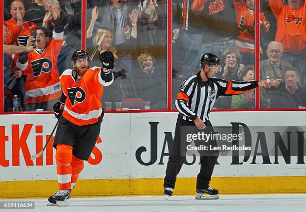 Referee Kyle Rehman signals a good goal as Jakub Voracek of the Philadelphia Flyers celebrates his successful second period penalty-shot attempt...