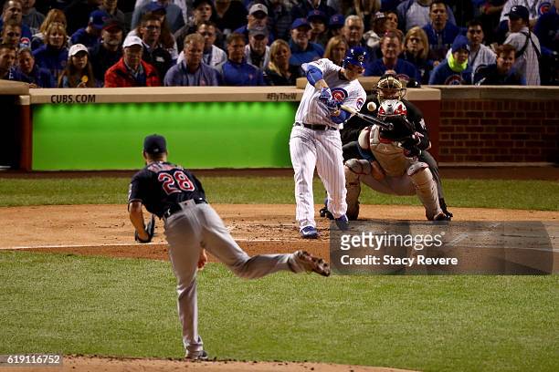 Anthony Rizzo of the Chicago Cubs hits a single off of Corey Kluber of the Cleveland Indians in the first inning in Game Four of the 2016 World...