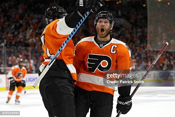 Claude Giroux of the Philadelphia Flyers celebrates after scoring a goal against Pittsburgh Penguins during the second period at Wells Fargo Center...