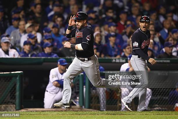 Jason Kipnis of the Cleveland Indians runs to home plate to score a run in the third inning against the Chicago Cubs in Game Four of the 2016 World...